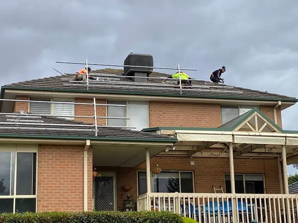 Shining Solar Energy solar panel installation team at work on a job.