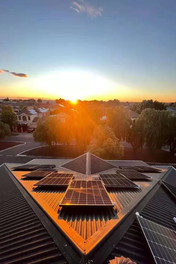 Home solar panels in the sunset.