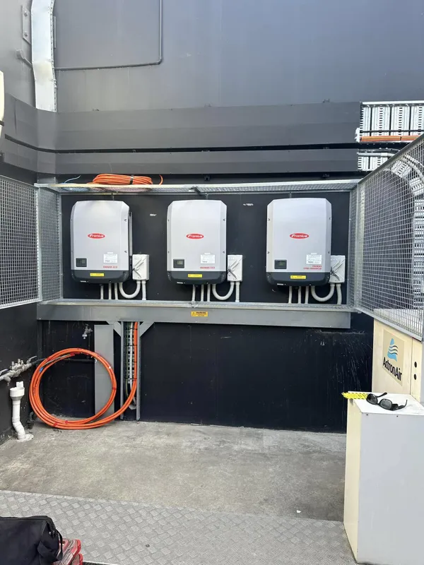 Three in a row Fronius inverters.